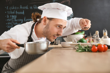 Male chef cooking in kitchen
