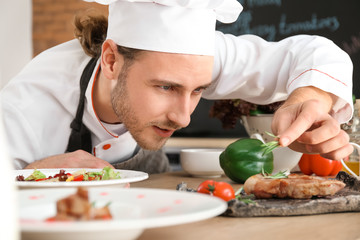 Male chef cooking in kitchen