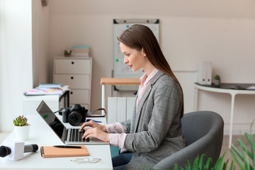 Female journalist working in office