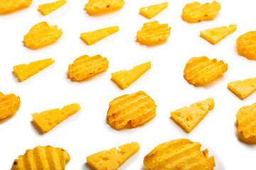 Tasty potato chips and cheese on white background