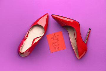 High-heels on color background. April Fool's Day prank
