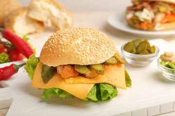 Tasty doner kebab in bun on table
