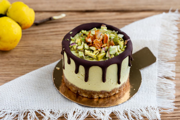  Raw healthy dessert. Orange cake with chocolate. Wooden background