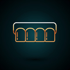 Gold line Dentures model icon isolated on dark blue background. Teeth of the upper jaw. Dental concept. Vector Illustration © Oksana