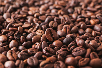 Many coffee beans as background