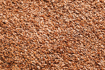 Many flax seeds as background