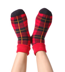 Legs of young woman in socks on white background