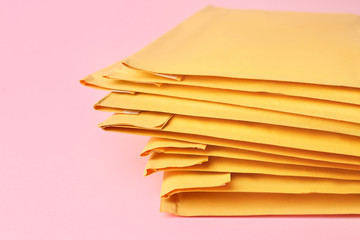 Paper envelopes on color background, closeup