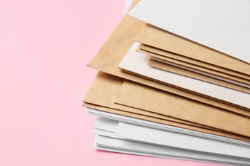 Paper envelopes on color background, closeup