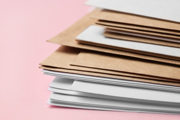 Paper envelopes on color background, closeup