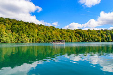 Fototapeta na wymiar Boat ride on turquoise lake at Plitvice Lakes National Park (Plitvicka Jezera), Croatia