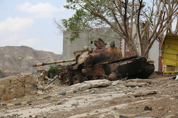 Fototapeta na wymiar A destroyed Houthi tank bombed by the Arab coalition aircraft in the Yemeni city of Taiz