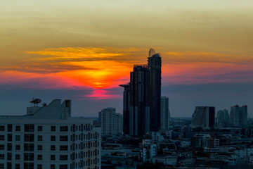 Fototapeta premium The abstract background of the evening sky and the surrounding buildings, showing the distribution of housing in the capital