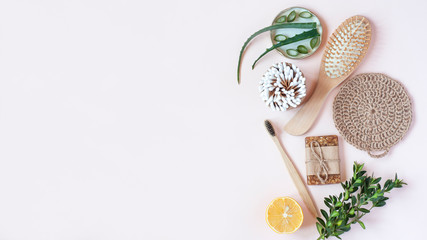 Zero waste personal care items on beige desk. Eco friendly body care products. Sustainable lifestyle concept. Flat lay, top view, copy space.