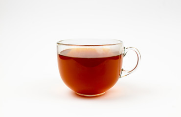 Glass cup of black tea. Isolated on white background