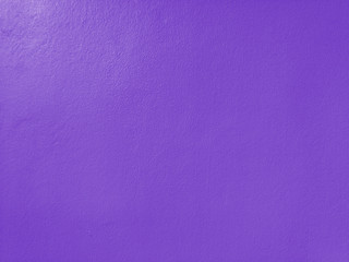 Concrete  violet  wall  background  with  copy  space.