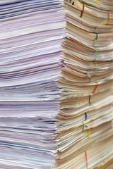 bundles bales of paper documents. stacks packs pile on the desk in the office