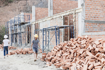 Children working at construction site for world day against child labor concept: