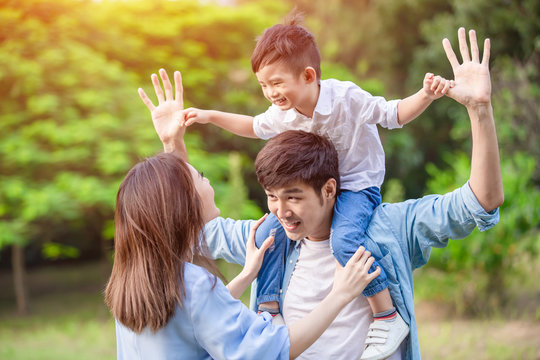 Young Parents Play With Kid