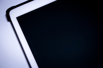 Blank tablet screen on white background.