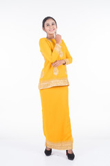 Obraz premium Beautiful female Asian model in various poses wearing modern kurung, a Malaysian traditional wear isolated on white background. Beauty and fashion concept. Full length portrait