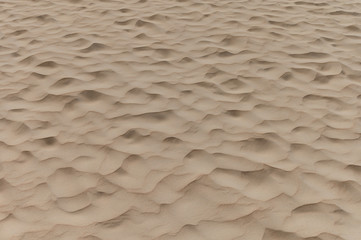 Wavy sand wave pattern on the beach ,backgrounds, textures image.