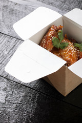 Spicy Chinese Take Out Food with sesame and mint leaf, vertical