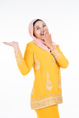 Obraz premium Beautiful female Muslim model in modern kurung and hijab, a modern lifestyle apparel for Muslim women isolated on white background. Beauty and hijab fashion concept. Full length portrait