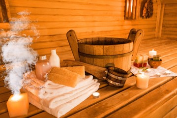 Interior of sauna and sauna accessories on background