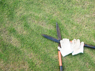 grass scissors and white glove