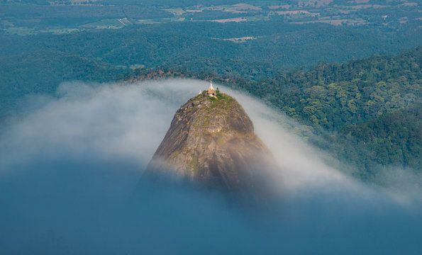 Spectacular view of Doi Nork covered with the mist, an iconic huge grey black rock in Doi Luang national park in Phayao province of Thailand. A &ldquo;Nork&rdquo; is mean the large shoulder hump on an Indian cow.