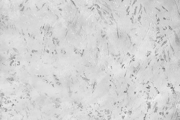Light grey art stucco spotted scratched background closeup, gray rough cement texture backdrop, monochrome concrete textured wall, matt silver plaster board, marble stone surface wallpaper, copy space