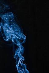 Blue smoke on black background