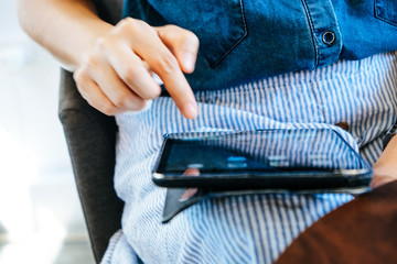 image of people using a digital tablet