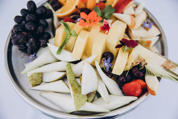 Fruit plate pears grapes apples pineapple berries macro