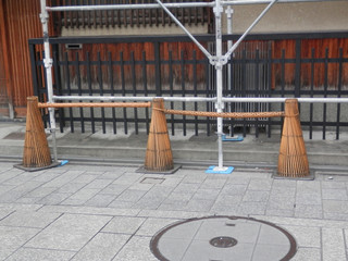 Bamboo trafic cones on Kyoto pavement