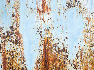 The blue metal sheet surface has rust stains.