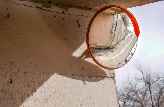 Concave Mirror Shows View Of Bike Path Around The Corner For Safety