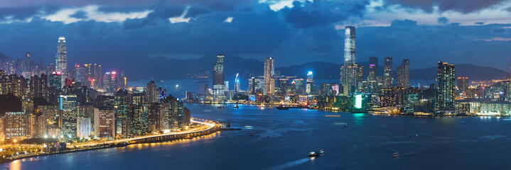Fototapeta na wymiar Panorama of Victoria harbor of Hong Kong city at dusk