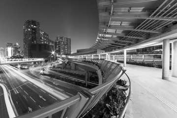 pedestrian walkway and traffic in Hong Kong city at night