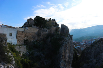 Fototapeta na wymiar View to San Jose castle on the rock in the evening, Castell de Guadalest, Spain