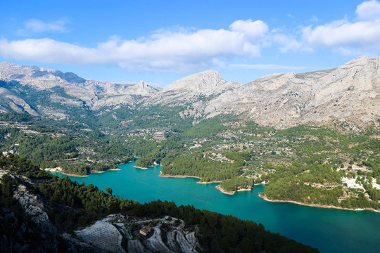 Panoramic view to beautiful azure Guadalest reservoir lake surrounded by mountains from the castle, Spain © Sergei Timofeev