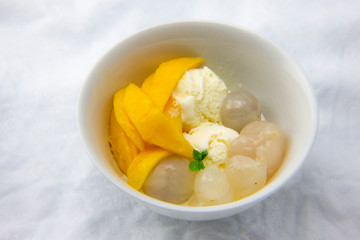 Garnished lychee and vanilla ice cream