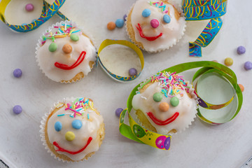 carnival clown muffins decorated with multi colored chocolate lentils