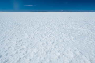 Naklejka na ściany i meble Flat and white surface of the Salar de Uyuni salt flat, Bolivia