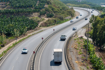 Turkish сoastal highway along the slope with banana plantations