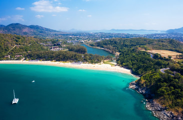 Fototapeta premium Aerial view of Nai Harn beach during high season, Phuket island, Thailand