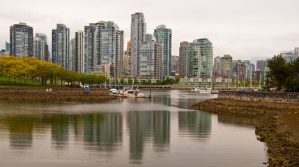 A view of rainy Yaletown from False Creek Sea walk. Downtown of Vancouver. Canada.