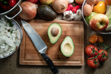avocado halves on a cutting board - top view