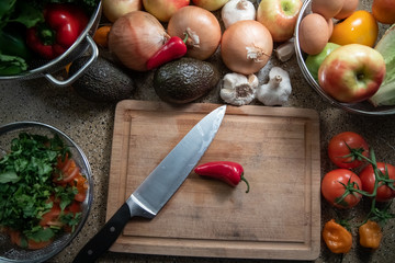 red hot chili pepper top view on a cutting board set on a kitchen counter